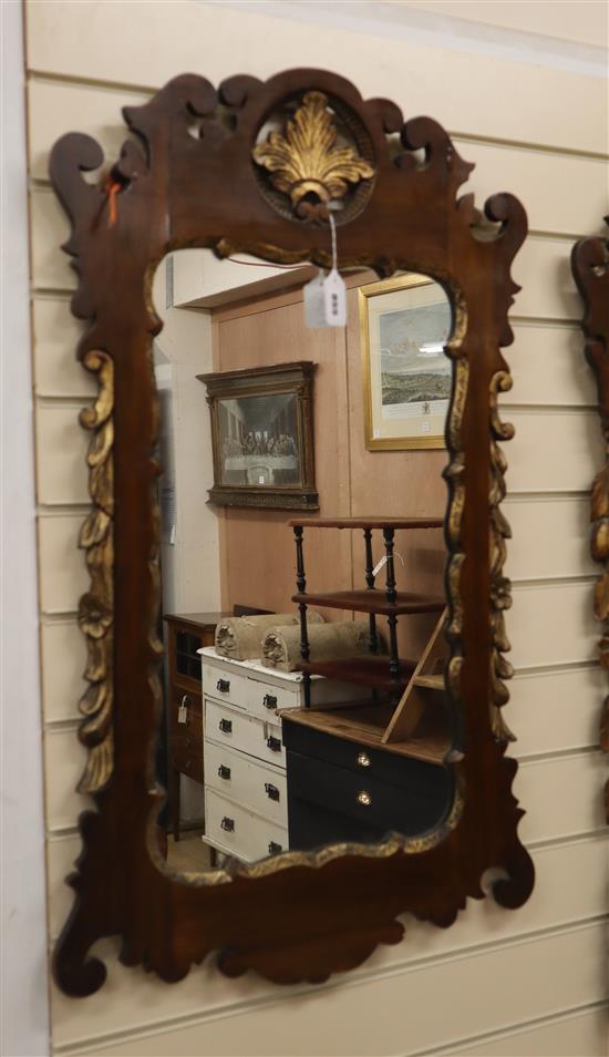 A George II style walnut and parcel gilt mirror H.92cm